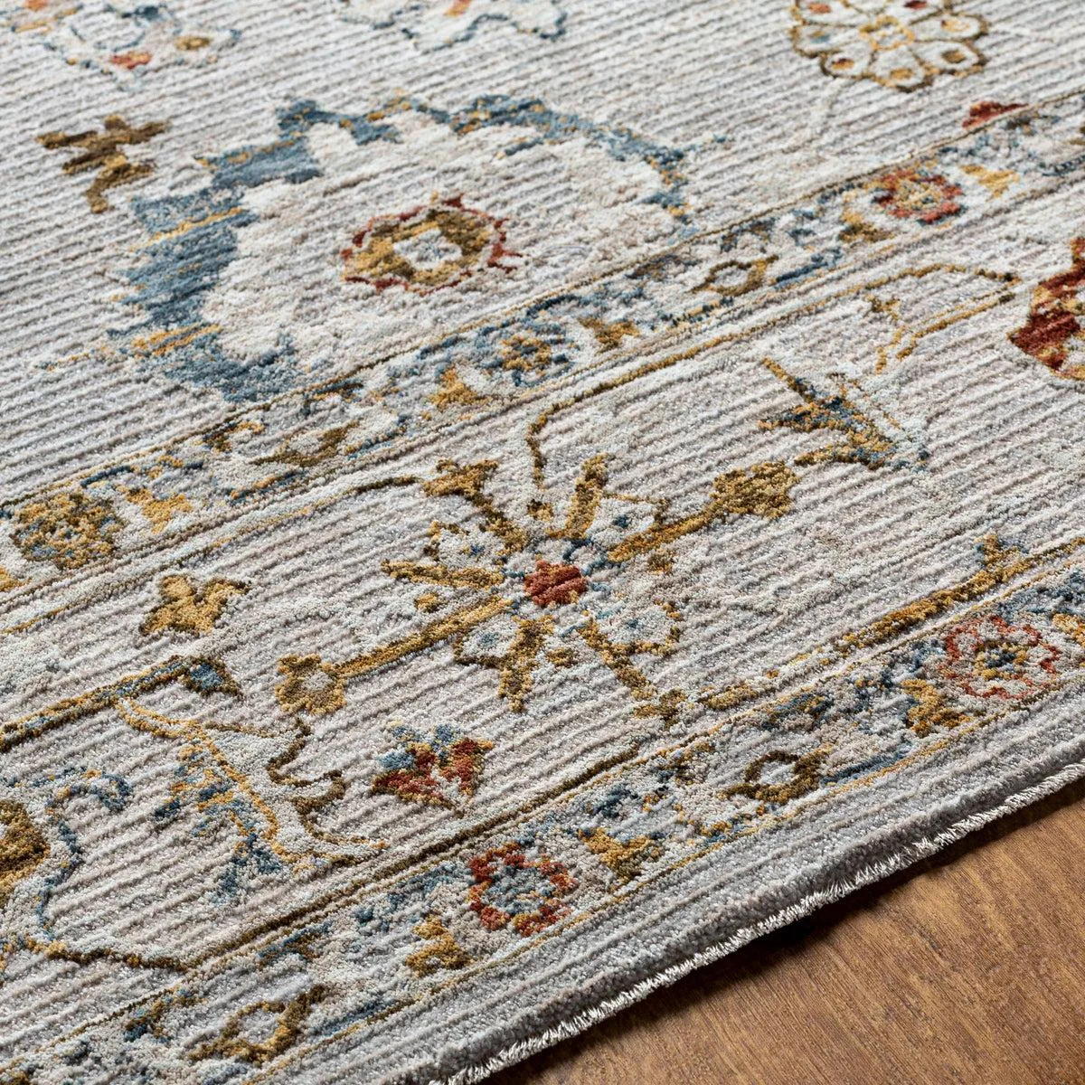Close-up of a patterned area rug showing its woven texture